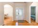 Welcoming foyer showcasing hardwood floors, front door with sidelights, and adjacent dining area at 640 Mackenzie Falls Dr, Fort Mill, SC 29715