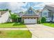 Charming home featuring a well-manicured lawn, brick accents, and a two-car garage in a residential neighborhood at 640 Mackenzie Falls Dr, Fort Mill, SC 29715
