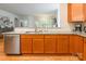 Open concept kitchen with stainless steel dishwasher and granite countertops at 640 Mackenzie Falls Dr, Fort Mill, SC 29715