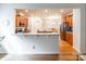 Open-concept kitchen with granite countertops, stainless steel appliances, and a breakfast bar open to dining room at 640 Mackenzie Falls Dr, Fort Mill, SC 29715