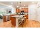 Bright kitchen features an island with barstool seating, stainless steel appliances and ample cabinet space at 640 Mackenzie Falls Dr, Fort Mill, SC 29715