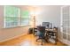 Well-lit office space with hardwood floors features a window and a desk with computer setup at 640 Mackenzie Falls Dr, Fort Mill, SC 29715