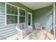 Cozy screened porch with wicker furniture and outdoor view offers a peaceful retreat at 640 Mackenzie Falls Dr, Fort Mill, SC 29715