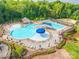 A well-maintained swimming pool with plenty of seating for relaxation at 640 Mackenzie Falls Dr, Fort Mill, SC 29715