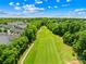 Overhead image of a well manicured golf course and residential homes in a green landscape at 6429 Terrace View Ct, Charlotte, NC 28269