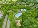 Overhead view of the community featuring a swimming pool, tennis courts, and playground at 6429 Terrace View Ct, Charlotte, NC 28269