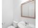 Bright bathroom featuring a modern sink, sleek fixtures, and a large framed mirror at 6429 Terrace View Ct, Charlotte, NC 28269
