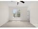Light and airy bedroom with neutral carpet and a large window, providing a comfortable and inviting space at 6429 Terrace View Ct, Charlotte, NC 28269
