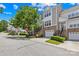 Inviting townhome with brick accents, a one-car garage, and well-maintained landscaping at 6429 Terrace View Ct, Charlotte, NC 28269