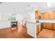 Open-concept kitchen with granite countertops, stainless steel appliances, and hardwood floors, perfect for entertaining at 6429 Terrace View Ct, Charlotte, NC 28269