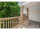 Relax on this wooden porch with views of the backyard and nature from the wood railing at 6429 Terrace View Ct, Charlotte, NC 28269