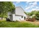 Exterior rear of home featuring white siding, a cozy deck, and well-maintained landscaping at 6824 Cortez Trl, Charlotte, NC 28227