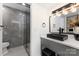 Sleek bathroom featuring a modern vanity, unique fixtures, and a glass-enclosed shower at 6824 Cortez Trl, Charlotte, NC 28227