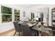 Bright dining room with views of the outdoor space from the large windows at 6824 Cortez Trl, Charlotte, NC 28227