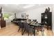 Dining room leads into the living space, with a modern light fixture and plenty of natural light at 6824 Cortez Trl, Charlotte, NC 28227