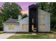 Charming exterior of a two-story home with white siding, black accents, and a well-manicured front yard at 6824 Cortez Trl, Charlotte, NC 28227