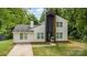 Stunning two-story home with modern design elements and professionally landscaped yard at 6824 Cortez Trl, Charlotte, NC 28227