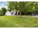 Well-manicured front yard with a long driveway and lush greenery surrounding the home at 6824 Cortez Trl, Charlotte, NC 28227