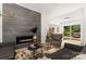 Modern living room featuring a fireplace, stylish decor, and a comfortable seating area at 6824 Cortez Trl, Charlotte, NC 28227
