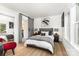 Comfortable bedroom with a cozy queen bed and a stylish barn door leading to the bathroom at 6824 Cortez Trl, Charlotte, NC 28227