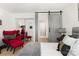 Comfortable bedroom with a cozy queen bed and a stylish barn door leading to another room at 6824 Cortez Trl, Charlotte, NC 28227