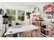 Bright office with a sewing machine, comfortable chair, and natural light from the window at 6824 Cortez Trl, Charlotte, NC 28227