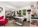 Bright office with a sewing machine, comfortable chair, and natural light from the window at 6824 Cortez Trl, Charlotte, NC 28227