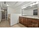 Spacious bathroom features double sinks, a wide mirror, and a separate shower and tub area at 715 N Graham St # 603, Charlotte, NC 28202