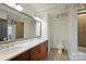 Bathroom featuring double sinks, a vanity with great storage, and a shower/tub combination at 715 N Graham St # 603, Charlotte, NC 28202