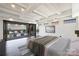 Bedroom boasts city views, with folding doors leading to a patio and ample natural light at 715 N Graham St # 603, Charlotte, NC 28202
