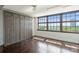 Bedroom with a built-in wardrobe and a large window offering natural light and city views at 715 N Graham St # 603, Charlotte, NC 28202