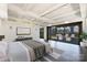 Modern bedroom featuring dark hardwood floors and a terrace with outdoor seating, offering city views at 715 N Graham St # 603, Charlotte, NC 28202