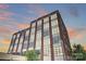 Exterior view of building, featuring brickwork, industrial-style windows, and architectural details at 715 N Graham St # 603, Charlotte, NC 28202