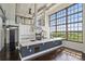 Bright modern kitchen with granite countertops, a large island, and industrial-style elements at 715 N Graham St # 603, Charlotte, NC 28202