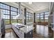 Well-appointed kitchen with stainless steel range hood, large windows, and modern finishes at 715 N Graham St # 603, Charlotte, NC 28202