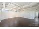 Bright living room features hardwood floors, recessed lighting and plenty of windows for natural light at 715 N Graham St # 603, Charlotte, NC 28202