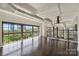 Bright living area with hardwood floors, staircase, large windows, and industrial-style ductwork at 715 N Graham St # 603, Charlotte, NC 28202