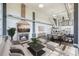 Inviting living room with a stone fireplace and open layout to the kitchen and dining area at 715 N Graham St # 603, Charlotte, NC 28202