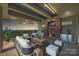 Enjoy outdoor living on a luxurious rooftop patio with fireplace, seating, and city views at 715 N Graham St # 603, Charlotte, NC 28202