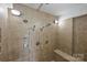 Walk-in shower with multiple shower heads and tiled bench at 715 N Graham St # 603, Charlotte, NC 28202