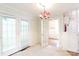 Dining area with neutral carpet, a chandelier, and access to other rooms at 723 Rabun Ln, Rock Hill, SC 29730