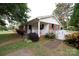 Charming single-story home with brick and vinyl siding, green shutters, and a covered front porch at 723 Rabun Ln, Rock Hill, SC 29730