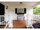 Covered front porch features a bench, flower box, and white railings at 723 Rabun Ln, Rock Hill, SC 29730