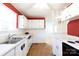 Bright kitchen with white cabinets, brick backsplash, double sink and views to another room at 723 Rabun Ln, Rock Hill, SC 29730