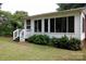View of a sunroom addition featuring windows and a staircase leading into the backyard at 723 Rabun Ln, Rock Hill, SC 29730