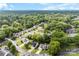 Aerial view of homes in a quiet neighborhood surrounded by lush greenery and trees at 7321 Mapleridge Dr, Charlotte, NC 28210