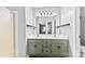 Bright bathroom features a double sink vanity with modern fixtures and a large mirror at 7321 Mapleridge Dr, Charlotte, NC 28210