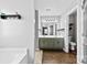 Bathroom with a double sink vanity, large mirror, and separate toilet room for added privacy at 7321 Mapleridge Dr, Charlotte, NC 28210