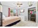 Cozy bedroom with a double bed, TV, closet, and window with natural light at 7321 Mapleridge Dr, Charlotte, NC 28210