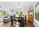Open dining area with hardwood floors, adjacent to the living room at 7321 Mapleridge Dr, Charlotte, NC 28210